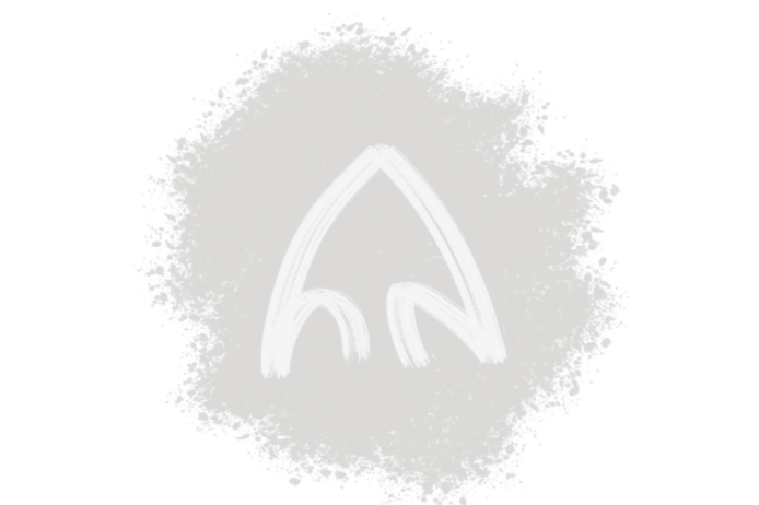 An arrowhead-shaped emblem in the center of a gray paint splatter.